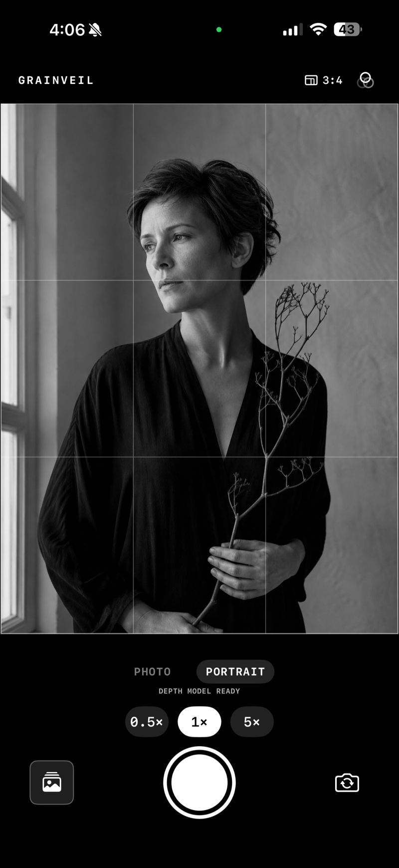 Grainveil Portrait mode showing an elegant black-and-white window-light portrait